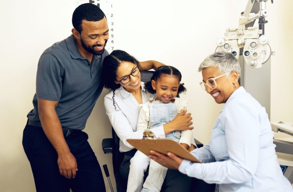 An optometrist discusses myopia control options with her young patient and their parents.