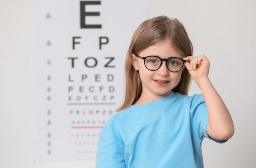 Young patient smiling wearing myopia glasses.